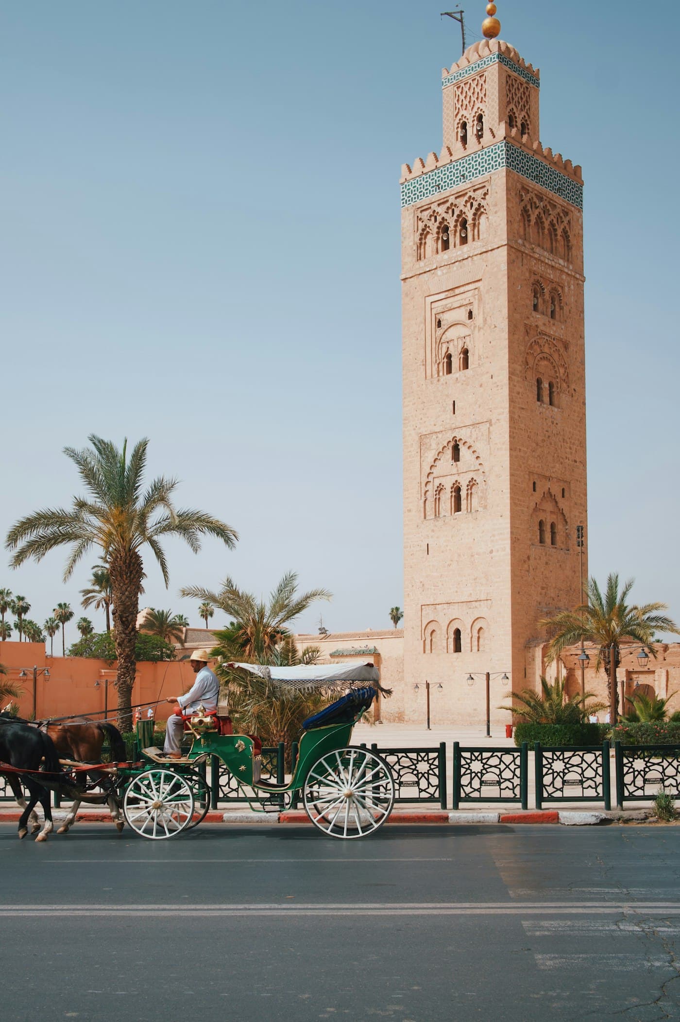 The Koutoubia Mosque minaret rising above Marrakech palms